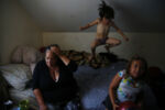 High on heroin after having relapsed after eight months, a frustrated Raquel Rodriguez begs her daughter Estrella to stop jumping up and down on the bed.
Raquel has been battling with addiction for the majority of her life. Born to a heroin addicted mother she has memories of drug use and sexual abuse by her early teens. She has tried to quit using heroin before but this time she is determined to get clean for her two young daughters. "I want them both to have a childhood that I never knew existed. Happiness, joy, love..." she said.