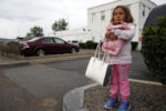 Mimi held her MomÕs purse and the puppy in her arms as she stood outside the clinic and waited for her mom to get her dose of methadone. Raquel brought home a new puppy the night before, and Mimi had begged Raquel to let her skip camp and spend the day with her and the puppy instead. It was only when they arrived at the clinic that Raquel realized they werenÕt allowed to bring pets inside.