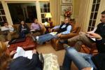 Governor-elect Charlie Baker, with feet up, holds his initial transition meeting at his Swampscott home, on Thursday, November 6, 2014. The attendees include Lt. Governor-elect Karyn Polito and the newly named executive director of transition Jim Peyser. In the meeting, they run through names for possible roles in the transition and administration.