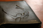 The daily briefing book of outgoing Governor Deval Patrick sits on his desk, as he swears in the last five judges.