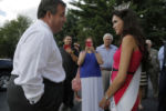 U.S. Republican presidential candidate and New Jersey Governor Chris Christie talks to Miss America's Outstanding Teen Allie Nault as he arrives for a campaign town hall meeting at Sayde's Neighborhood Bar and Grill in Salem, New Hampshire August 24, 2015.