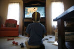 Rathdrum, Idaho -- 2/15/2015-- Leo, who did not know how to speak English when he first came to the United States, is now fluent in American cartoons and video games. LaddÕs father, Richard Serwat, obliged with a screening of ÒScooby-DooÓ at the family's home in Rathdrum, Idaho.