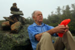 Bretton Woods, NH-09/08/15 -Ninety year-old Richard Dreselly from Topsham, Maine is the oldest man to climb Mt. Washington. He takes a break against a rock cairn two hours into the hike on the Crawford Path.