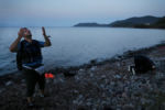 Samer Shkeer, a Syrian refugee, prayed after crossing the Mediterranean and arriving on the shore of Skala Sykaminias on the island of Lesbos, Greece. Migrants, many of them war refugees, pour onto a once-tranquil Greek island in hope of reaching a land where they can start life anew.