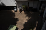 Nurse Carol Apondi relaxes during family visiting hours at the Texas Cancer Center in Nairobi, Kenya on Thursday, Aug. 27, 2015. Nurses here are trained in palliative care and give round the clock care to over a dozen patients in this small medical building.