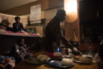 8/11/15 – Johannesburg, South Africa – Sheila Kadende, 42, prepares dinner in her apartment in the Moth building in Joubert Park on Tuesday, Aug. 11, 2015. The residents here were evicted from their previous building in New Town to make way for a new mall under construction.