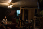 10/21/15 – Bagdad, KY – Andrew plays video games in his brother's room at the Keach family farm in Bagdad, Ky. on Wednesday, Oct. 21, 2015. Amy, who's husband's military career leaves her without him for most of the year, started showing goats and selling their kids several years ago.