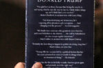 January 26, 2016 - An attendee holds a copy of Donald Trump's book for Trump to sign after his speach at a rally at Farmington High School in Farmington, N.H.