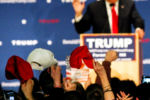 January 26, 2016 - Attendees wave their hats as Donald Trump speaks during a rally at Farmington High School in Farmington, N.H.