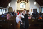 5/16/2015 - Baby Alexandra Chu was Sanctuary UCC's first baptism since selling the church and moving into the storefront. They borrowed a nearby church for the event because their small storefront space was too small to fit all the attendees.