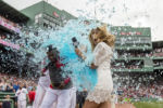BOSTON, MA - MAY 14: David Ortiz #34 of the Boston Red Sox reacts as he is given a Powerade bath alongside NESN reporter Guerin Austin after hitting a game winning walk-off single during the eleventh inning of a game against the Houston Astros on May 14, 2016 at Fenway Park in Boston, Massachusetts.