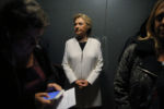 U.S. Democratic presidential nominee Hillary Clinton rides an elevator with aides as she arrives for a campaign concert with Katy Perry in Philadelphia, Pennsylvania November 5, 2016.