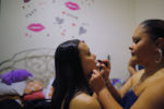 Eighteen year-old Precious Perez, who has been blind since birth, gets help with her lipstick from her mother Jennifer (R) as Precious gets dressed for prom at her home in Chelsea, Massachusetts May 21, 2016.