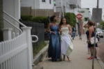 Eighteen year-old Precious Perez, who has been blind since brith, and her friend Maddy Wilson (L) walk to the car go to Precious' prom in Chelsea, Massachusetts May 21, 2016.