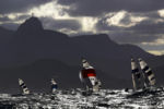The Men's 470 sailing fleet competes under the Christ the Redeemer statue at the 2016 Rio Summer Olympics in Rio de Janeiro, Brazil August 11, 2016.