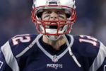 New England Patriots quarterback Tom Brady yells as he takes to the field before facing their 2015 Super Bowl rival Seattle Seahawks in Foxborough.