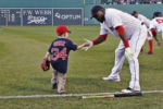 Farewell Big Papi - career final season of slugger David Ortiz
Six-year-old Maverick Schutte, who has undergone more than 30 surgical procedures because of a congenital heart defect, slaps a low-five to Boston Red Sox designated hitter David Ortiz prior to a baseball game. Ortiz fulfilled a promise to hit a home run just for Schutte in a recent game against the New York Yankees.