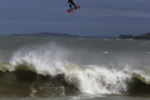 Jeremy Reger, 36, of South Boston catches air over a wave as he kite surfs in Winthrop, MA, September 5, 2016.