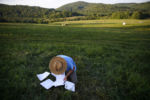 Judge Sam Fuller, Services Director of Northeast Organic Farming Association of Vermont tallies the results in the 2nd Annual Farmer Olympics.