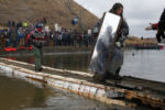 In Cannon Ball, North Dakota thousands of protesters joined with the Standing Rock Sioux in opposition to the construction of a portion of the North Dakota Access Pipeline which they said would threaten their water supply.
A protester walks back across a hastily constructed bridge on Thanksgiving day after a peaceful standoff against police on Turtle Island.