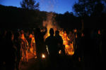 On the last night of the gathering the drum circle around the bonfire in the meadow intensifies. People gather around to dance and sing before descending into silence when the sun rises.