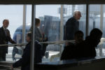 U.S. Democratic presidential candidate and U.S. Senator Bernie Sanders (top R) walks up the jetway to his campaign plane in Hibbing, Minnesota February 26, 2016.