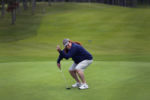Lindsey Straus gestures as she sinks a putt playing nine holes at The Captains Golf Course. She tees off the at the mens tee, and dresses as a man, because she doesn't want other golfers to feel uncomfortable.