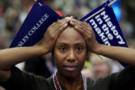 Wellesley College alum Maria Manning holds her head while watching results during an Election Night party at the college in Wellesley, MA. Results from Michigan were too close to call and Maria said she examining the electoral path to the presidency for Clinton. Election night watchers at Wellesley College alternated between joyous applause and nervous chatter, praying into the late evening for Hillary Clinton to pull off what seemed like an improbable presidential win.