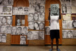 Senior Phillip Sossou spent four months secretly sketching portraits of seniors at Boston Latin School, capturing their smiles, the glint in their eyes, the contours of their faces.
And on the final day of classes for seniors Ñ the teenager went to the school with six friends and finished affixing 411 charcoal portraits along the first-floor walls.
It made for a stunning display of school pride, a gift Sossou said he wanted to leave with his classmates.
