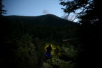 By 7:30 p.m., the woods are dark. Stacey puts on her head lamps to navigate the trail.
While paused for a minute, StaceyÕs left brace begins to beep. The brace has been malfunctioning most of the day, making it difficult for Stacey to bend her knee. She and Sarah groan over the audio addition confirming the malfunction.
The hiking is extremely slow in the darkness. By 11 p.m. StaceyÕs right brace has lost its charge and is locked up. Now, she must push forward stiff-legged.