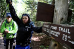 Arriving at a marker on the Chimney Pond Trail, Stacey jokingly lifts her arm in triumph. ItÕs been 27 hours since she started the climb, and her relief to see light at the end of this path is obvious. They will soon arrive at a campground.
The previous evening neither woman had slept. Instead, they spent the hours lying silently on the cold boulders, miserable.