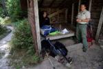 Stacey talks with Ranger Jen Sinsabaugh while resting in a lean-to at the Chimney Pond campground.
Loome and Sinsabaugh explain that the parkÕs lead ranger advised Stacey not to attempt the summit. Search-and-rescue procedures, the rangers say, are expensive, and Stacey would be held financially responsible if a rescue was necessary.