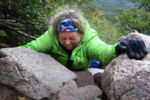 A mile from the summit a row of boulders blocks StaceyÕs path. She will spend an hour at this spot. The three boulders make a solid wall in front of her. There is no easy way over them or around them. She studies the rocks with frustration. She makes an attempt to pull herself over them. She stops. ÒThis is not hiking, this is rock climbing.Ó
Finally, Stacey pulls herself 2 feet up a slanted boulder. Then she winces as she slides back down.
