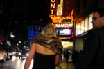 STORY SUMMARY - A typical Friday in the Theatre District, an eclectic Boston neighborhood like no other in the city, one that changes shape as the hours pass. Daytime hours give way to theater aficionados and tourists in the evening, and partygoers and the downtrodden at night. In the transitions, groups of vastly different social and economic backgrounds blend, transforming the neighborhood that borders Boston Common, Downtown Crossing, and Chinatown.
CAPTION- Marie-Claude Misson and Steeve Gagnon walk along Washington Street after seeing ÒCarmenÓ at the Boston Opera House.