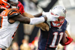 New England Patriots Julian Edelman tries to fight off Cincinnati Benglas Dre Kirkpatrick during an NFL football game at Gillette Stadium in Foxborough, Mass. Sunday, Oct. 16, 2016.