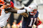 New England Patriots Julian Edelman tries to fight off Cincinnati Benglas Dre Kirkpatrick during an NFL football game at Gillette Stadium in Foxborough, Mass. Sunday, Oct. 16, 2016.