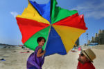 It was very hot and very windy at Revere Beach as Abra Ordorica,5 from Dorchester had to hold on to the umbrella from blowing away as her father, Dan, got a chuckle out of watching her.