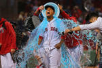 Boston Red Sox vs Houston Astros- Red Sox Xander Bogaerts get drenched with a bucket of sports drink as he is interviewed in front of the dugout after the game in which the Sox won in dramatic fashion on his walkoff rbi single in the 9th inning.
