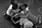 Teacher Jangle Ridley gets a group hug by the boxing students at the end of the boxing class. Ridley came down to watch her students.