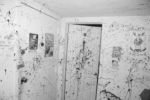 An entry way splattered with black paint. Unknown warehouse venue in Allston. This venue no longer exists.