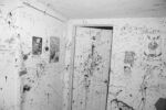 An entry way splattered with black paint. Unknown warehouse venue in Allston. This venue no longer exists.