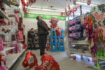 Feb. 14, 2017 – Professional singing telegram performer Scott Galbraith, 39, of Boston, Massachusetts, picks out Valentine’s Day balloons at a Dollar Tree in Malden, Massachusetts in preparation for his seven scheduled deliveries.