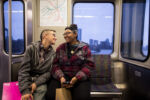 Liniște, left, a 22-year-old gay woman who is experiencing homelessness, rides on the MBTA Red Line with her girlfriend Tay on Nov. 27, 2016 in Boston, MA.