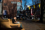 Liniște, a 22-year-old gay woman experiencing homelessness, avoids shelters and gets most of her sleep during naps in parks like this, near Harvard Square in Cambridge, MA.