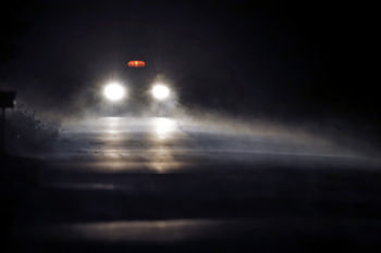 A taxi filled with migrants drives through the fog down Roxham Road in Champlain, N.Y., while heading to an unofficial border station across from Saint-Bernard-de-Lacolle, Quebec, early Tuesday morning, Aug. 8, 2017. Officials on both sides of the border first began to notice last fall, around the time of the U.S. presidential election, that more people were crossing at Roxham Road. Since then the numbers have continued to climb.