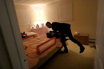 The Last Refugee: Through the Closing Door
2. Abdulkader Hayani, in the first moments of arriving at his new home in Framingham, puts his youngest daughter, Ameeneh, to bed. He tried not to dwell on the things he had lost. He willed himself into the present, for the sake of his family, their future. The only way forward was to make a life here.