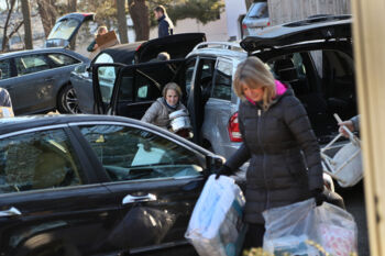 The Last Refugee: Through the Closing Door
3. Members of Temple Beth Elohim of Wellesley carried household items into the home they prepared for a family of six.The Hayani family moved in three days later. Settling Syrian refugees in Boston's western suburbs was an experiment the State Department and its partners had initially been reluctant to approve. The areaÕs high cost of living was considered risky for people already facing obstacles. Nevertheless, a small army of volunteers and community leaders was determined to try and make it work.
