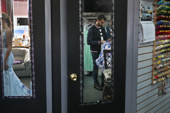 The Last Refugee: Through the Closing Door
9. Abdulkader has a tryout at a tailor shop in Worcester.
In Syria, where tailoring was an important and respected craft, it was Abdulkader who had been in charge. In Aleppo, before the war, he had owned his own business. There, he was the master tailor, overseeing six employees and 10 sewing machines.
This tryout would not yield an offer of full-time work that could support his family. Additionally, In Syria men and women went to separate tailoring shops, and Abdulkader, a devout Muslim, worried how he would maneuver having to measure women in America. Six weeks later, that problem worked itself out when he was hired by Brooks Brothers to tailor men's suits.