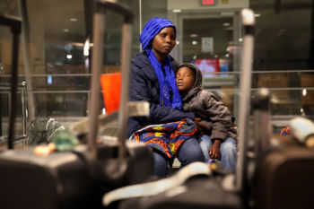 SYNOPSIS- One of the last refugee families to be resettled in New England arrived in Manchester, N.H., on Thursday February 2, 2017. President Trump issued an executive order the previous week that barred any new refugees for 120 days, but they were allowed entrance due to a waiver for previously approved refugees. Sendegeya Bayavuge, a 52-year-old farmer, and six other members of the family had been living at a refugee camp in Uganda for two decades after escaping the violence in The Democratic Republic of Congo.
CAPTION - Vanisi Uzamukunda comforts her sleepy daughter Sarah, 7, while waiting for their baggage at the ManchesterÐBoston Regional Airport . ÒWe heard no more refugees could come to America. So, for us to come to America, we are very happy,Ó the 43-year-old matriarch, said through an interpreter.