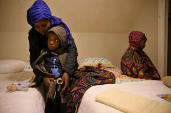 Vanisi helps her daughters, Sarah and Lea, get ready for bed in their new room.
Hardship has been a constant. Their lives were shattered two decades ago when the parents fled unending violence in the Democratic Republic of Congo. But here was a fresh start only a 28-hour, continent-hopping odyssey away from their home in Uganda.